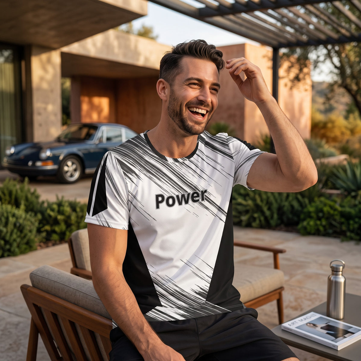 Good Wishes 365 men's athletic t-shirt with black and white abstract print and Power text, worn by a smiling man.
