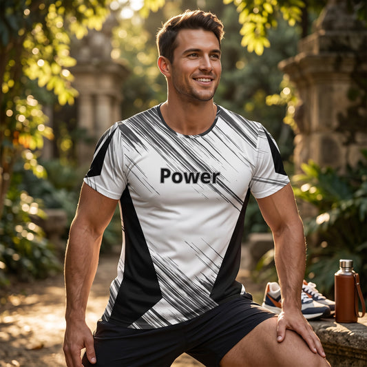 Good Wishes 365 men's athletic t-shirt with black and white abstract print and Power text in a sunny outdoor setting.
