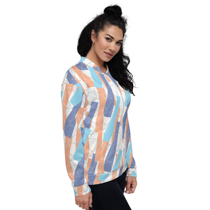 Good Wishes 365 unisex bomber jacket with abstract orange, blue, and periwinkle geometric print on a woman