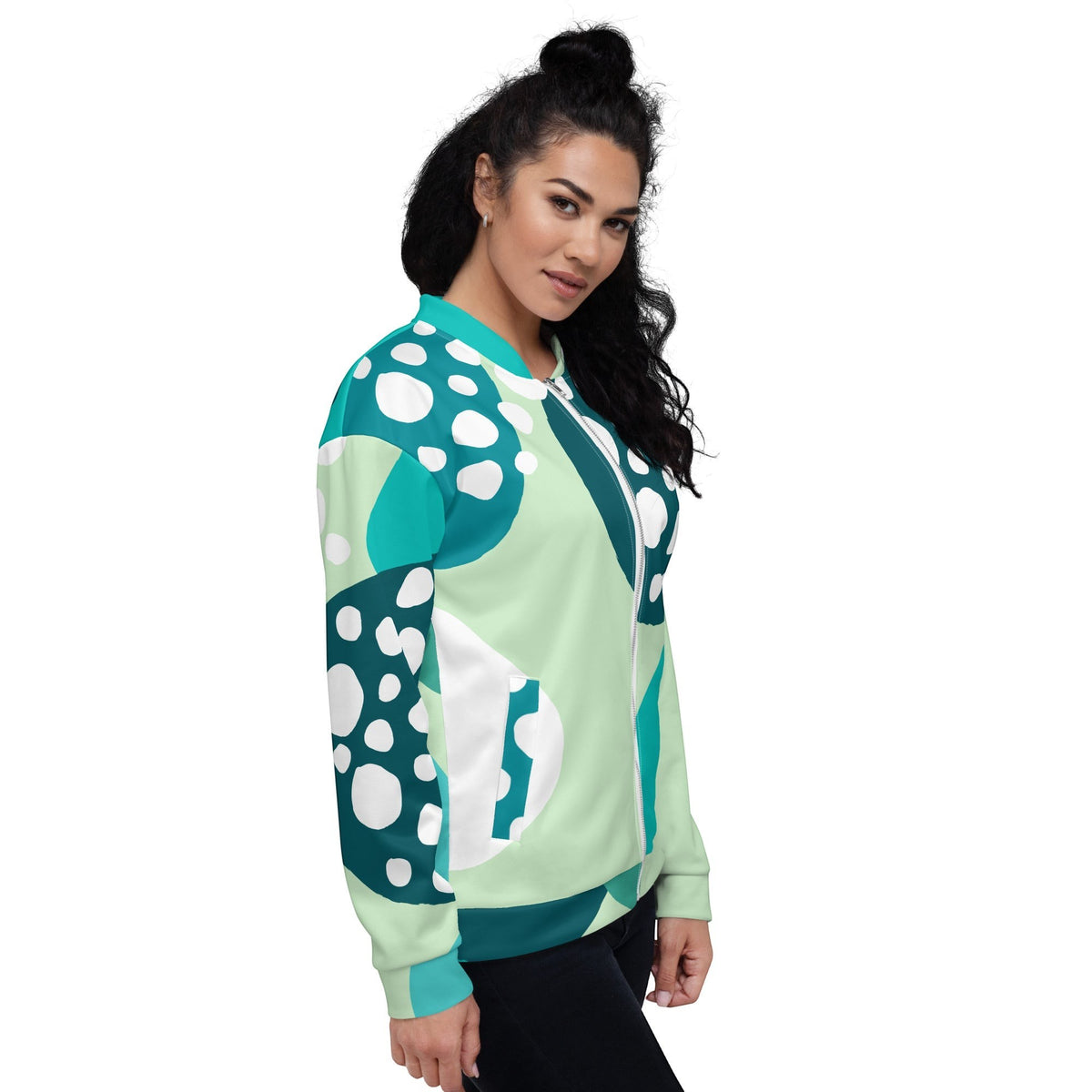 Good Wishes 365 unisex bomber jacket featuring an Eastern Blue and mint green abstract circular print on a model.