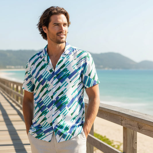 Good Wishes 365 Men's oversized short sleeve button-up shirt with abstract blue, green, and white print. Made from recycled polyester.