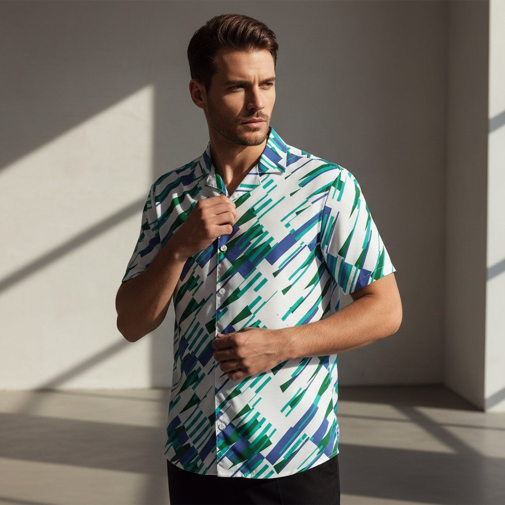 Good Wishes 365 Men's oversized short sleeve button-up shirt with abstract blue, green, and white print. Made from recycled polyester.