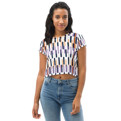 Good Wishes 365 model wearing a white crop tee with a colorful vertical dash all-over print and four-way stretch fabric.