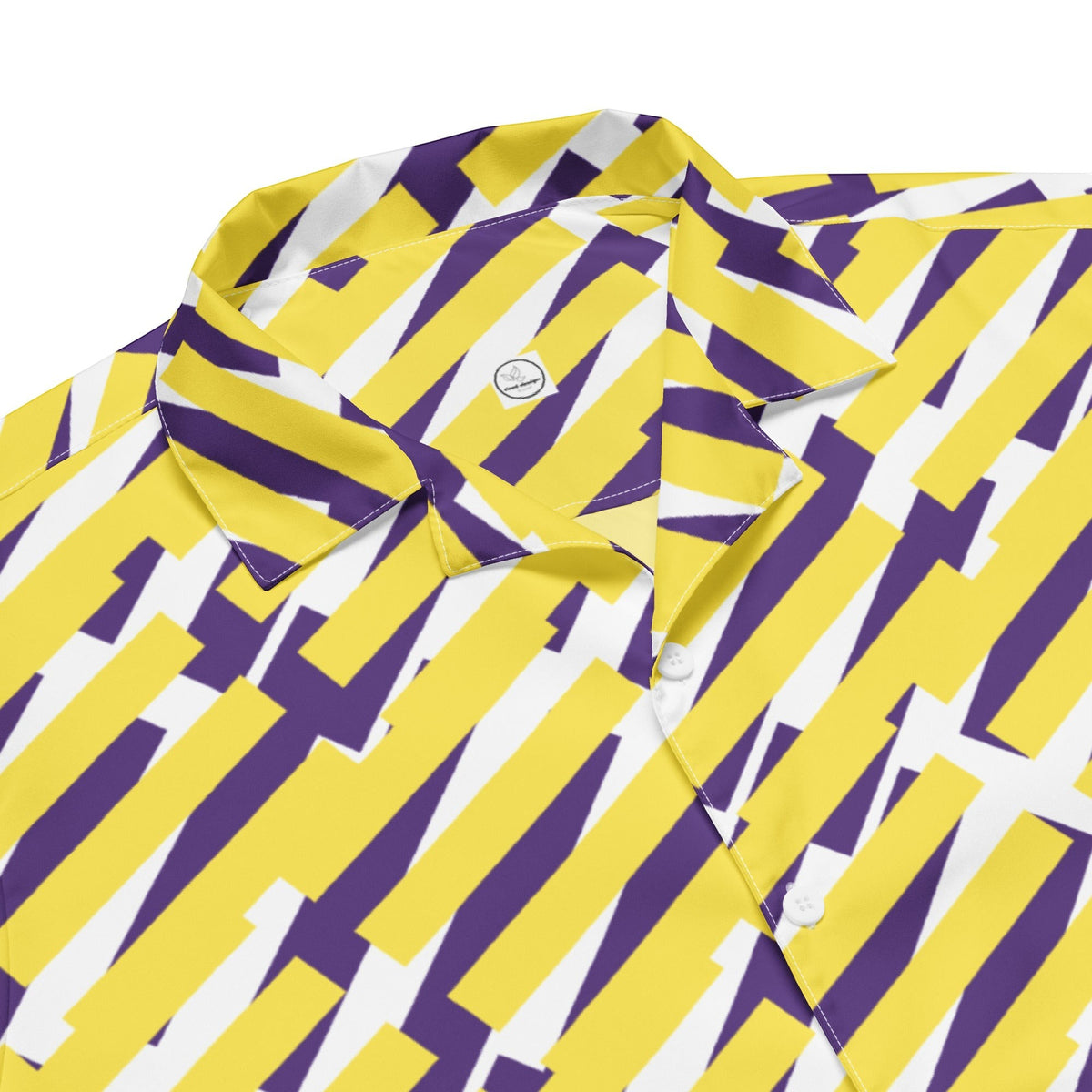 Good Wishes 365 short sleeve button down shirt featuring a vibrant yellow, purple, and white geometric pattern, product detail. 