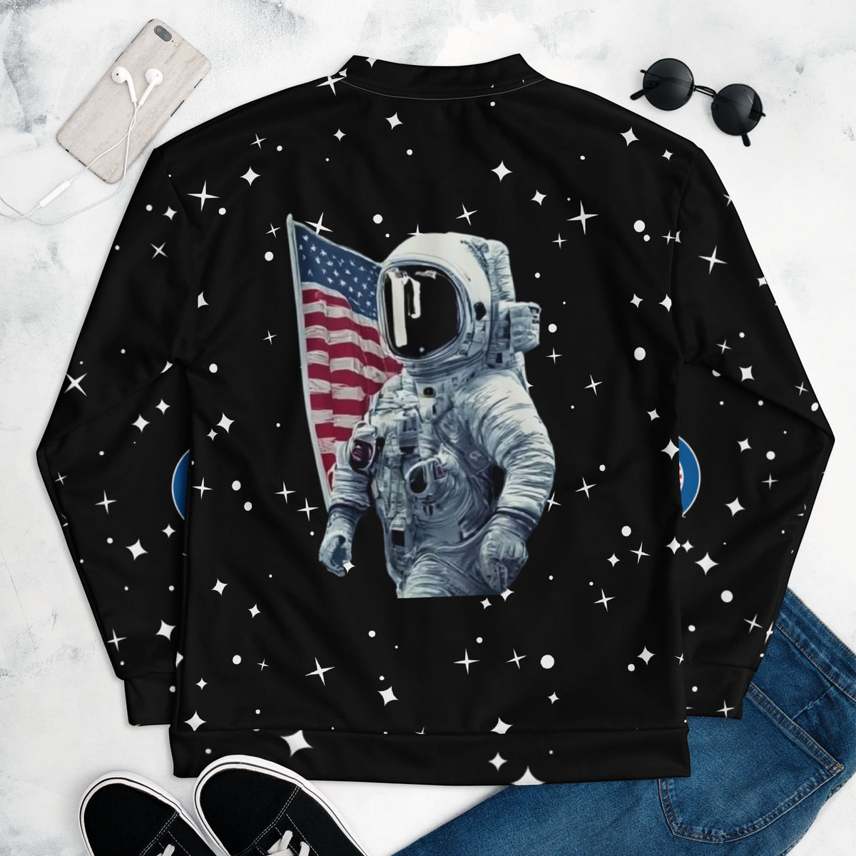 Good Wishes 365 unisex bomber jacket featuring a retro astronaut and US flag print on a black starry background.