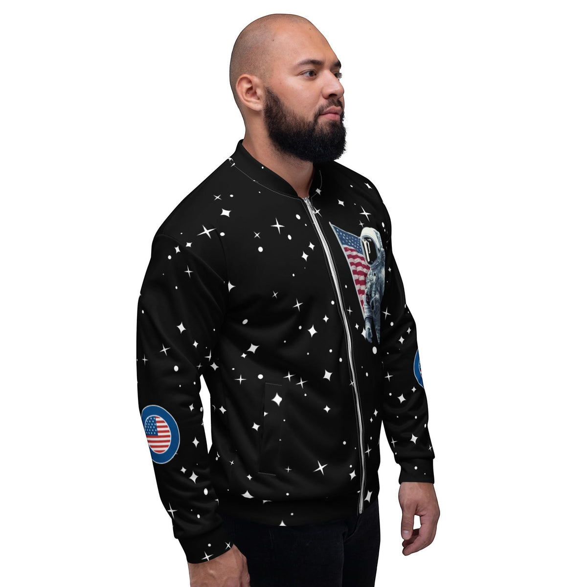 Good Wishes 365 black unisex bomber jacket with astronaut and star print worn by a man in profile view