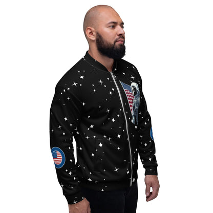 Good Wishes 365 black unisex bomber jacket with astronaut and star print worn by a man in profile view