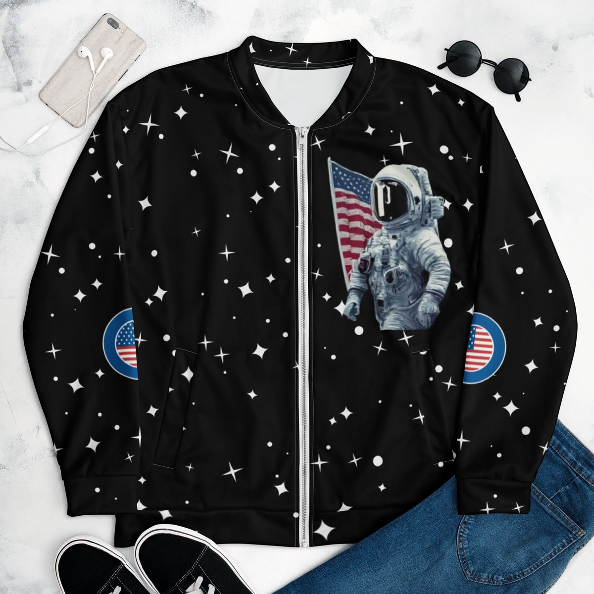 Good Wishes 365 black bomber jacket featuring an astronaut and American flag print with a retro star pattern.