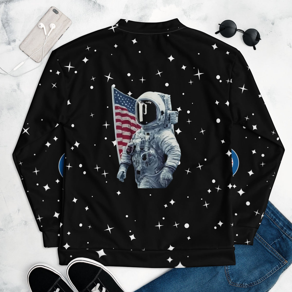 Good Wishes 365 black unisex bomber jacket featuring a retro astronaut and American flag print with a star pattern