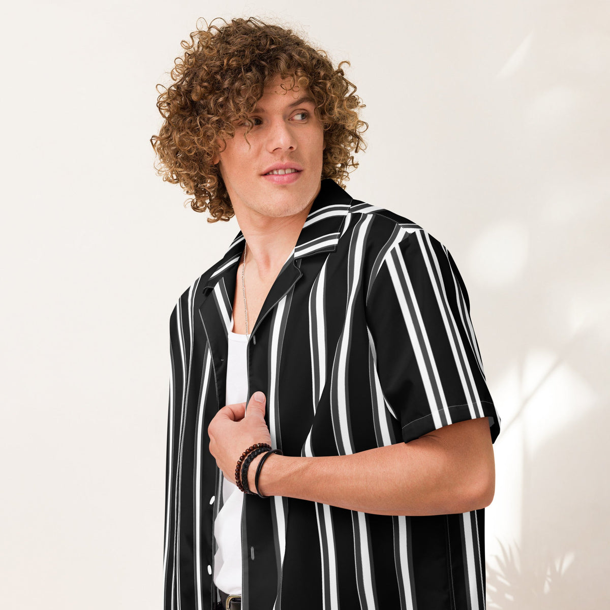 Good Wishes 365 unisex black and white vertical striped short sleeve button-up shirt with a camp collar.