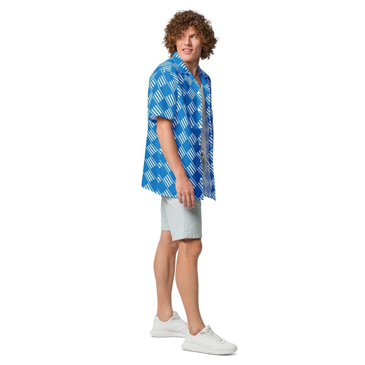 Good Wishes 365 blue short sleeve button down shirt with white geometric pattern worn by a man with curly hair