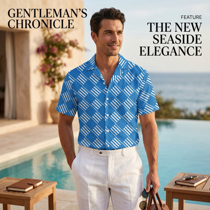 Good Wishes 365 blue short sleeve button down shirt with white geometric pattern worn by a man at a seaside resort