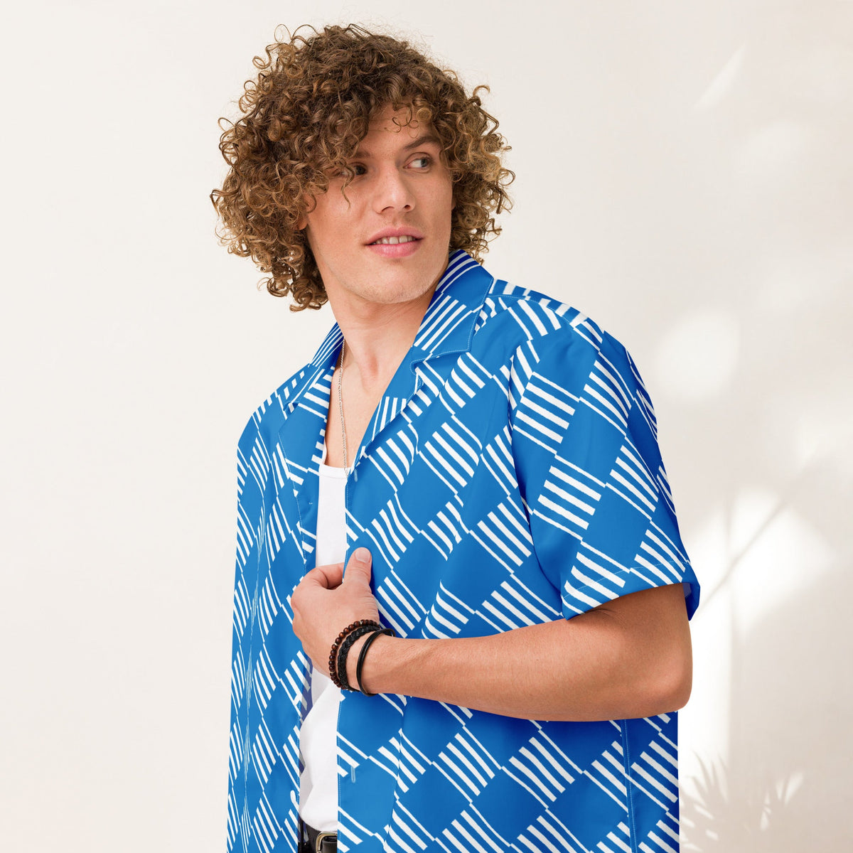 Good Wishes 365 blue short sleeve button down shirt with white geometric pattern and camp collar worn by a man