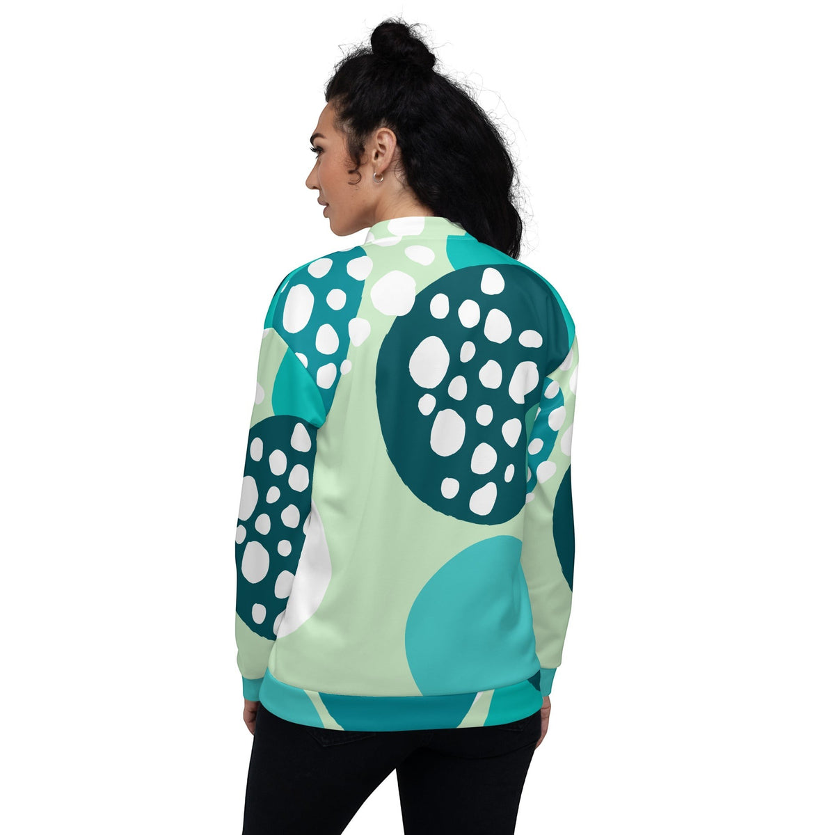 Good Wishes 365 unisex bomber jacket with Eastern blue and mint green abstract circular print, back view on a model.