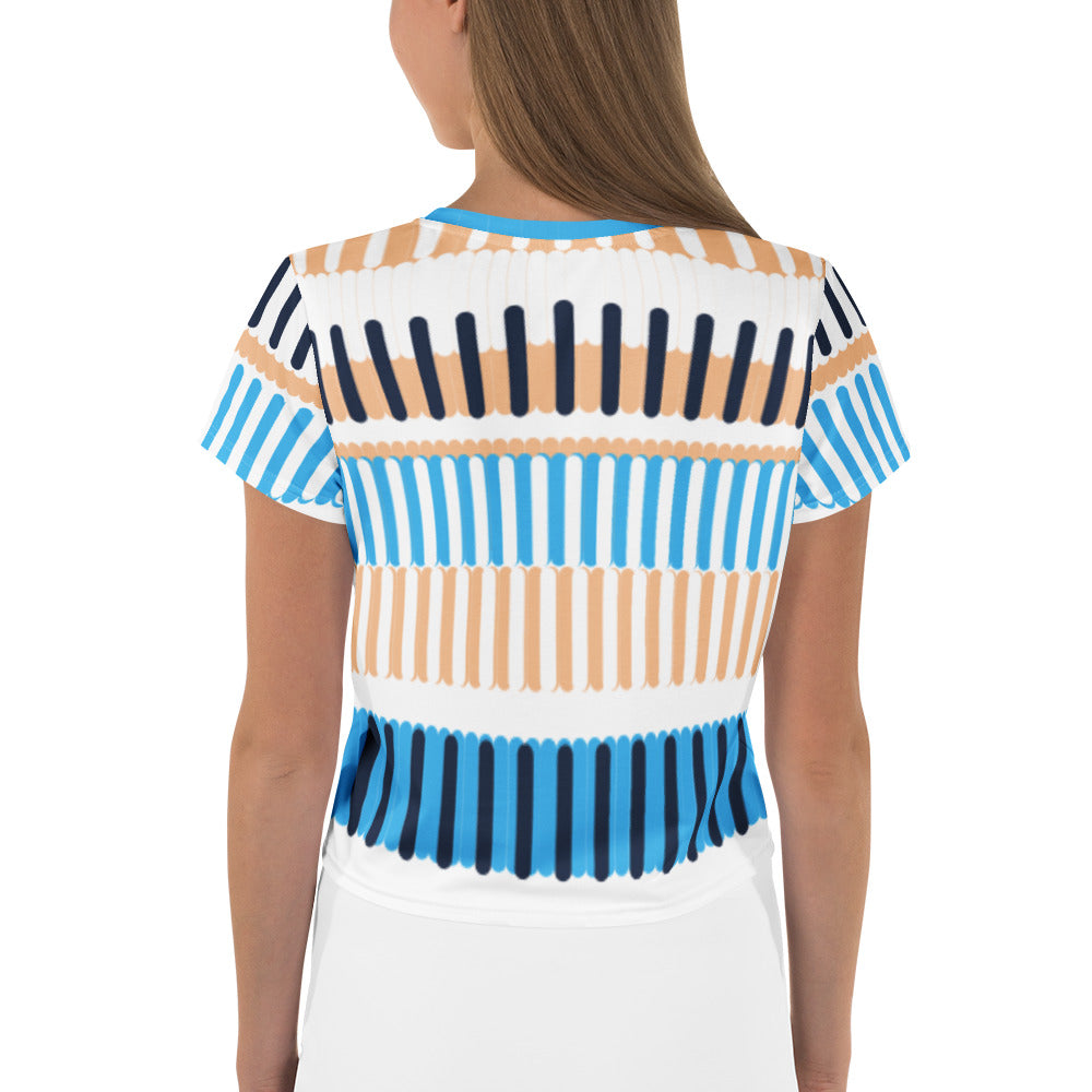 Good Wishes 365 crop tee with blue, navy, and sand coastal stripe print, shown from the back on a model.
