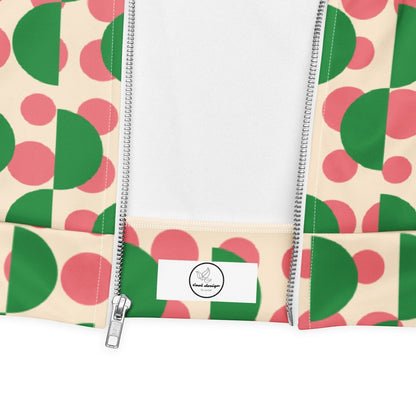 Good Wishes 365 unisex bomber jacket with cream background, pink polka dots, and green semi-circles, featuring a zipper