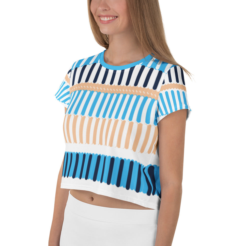 Good Wishes 365 crop tee with blue, navy, and sand vertical stripe coastal print worn by a smiling woman