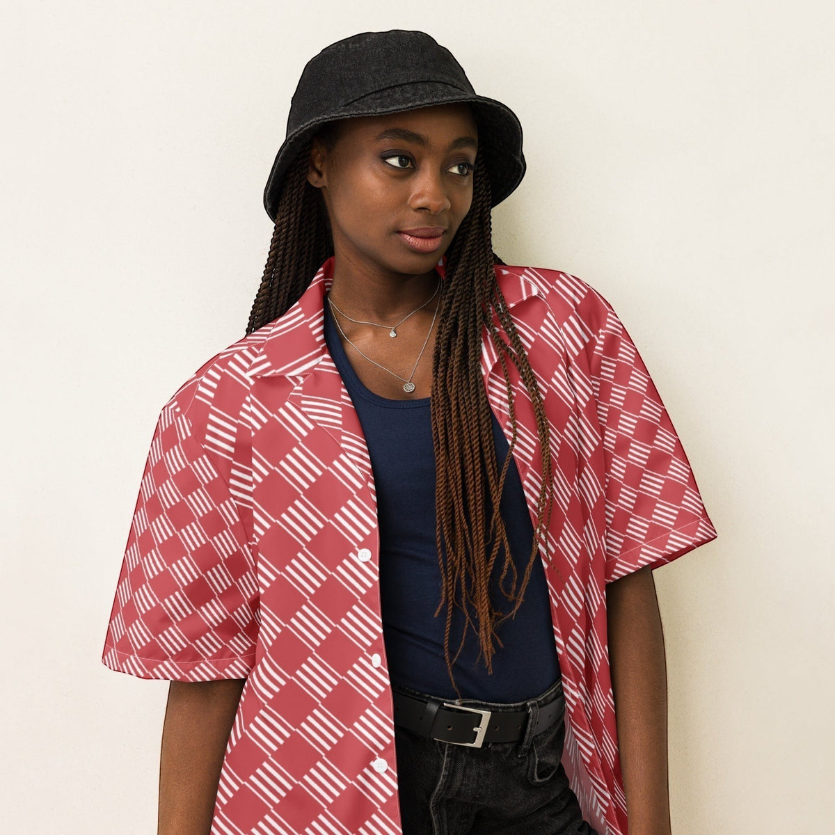 Good Wishes 365 unisex coral pink short sleeve button-down shirt with white geometric stripes worn over a navy tank