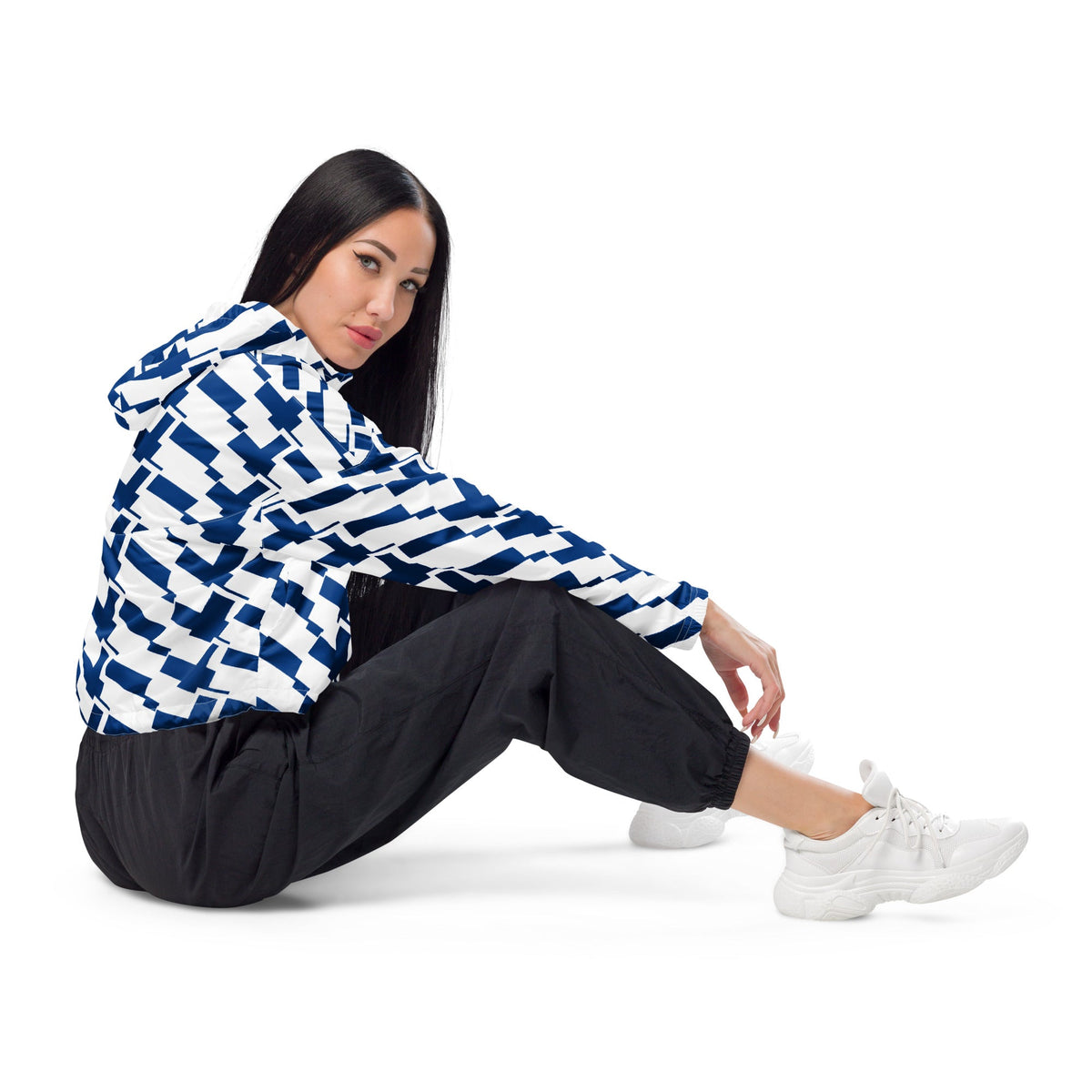 Good Wishes 365 women's cropped windbreaker with blue and white Finnish flag print, worn with black joggers.