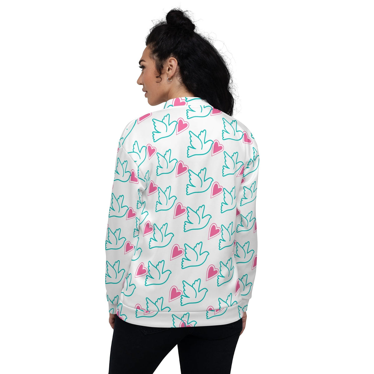 Good Wishes 365 bomber jacket with teal dove and pink heart print on white, worn by a woman, back view.