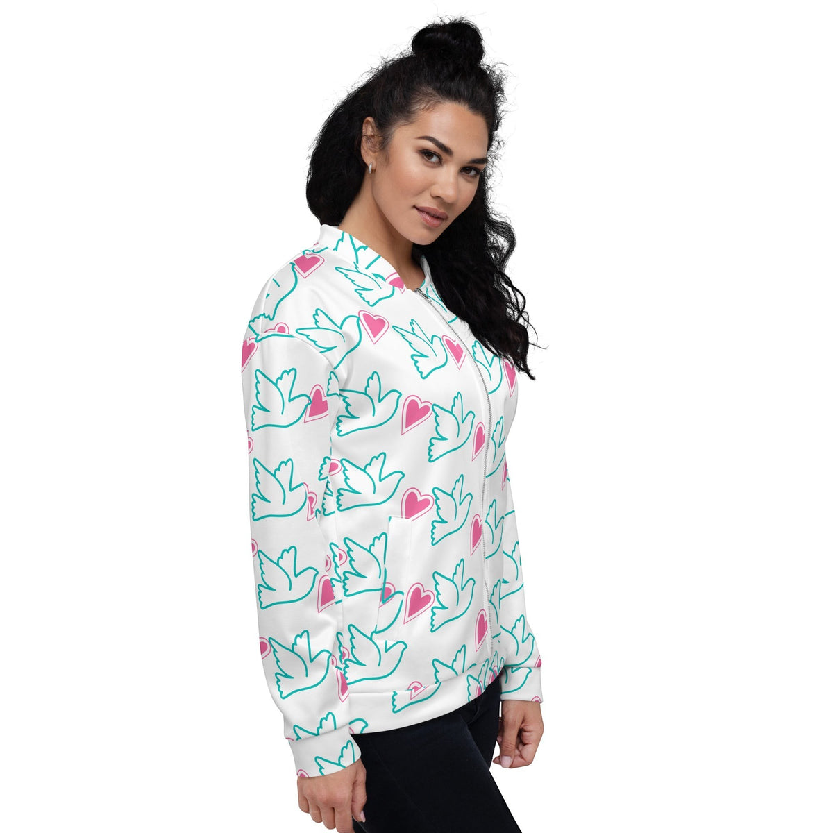 Good Wishes 365 bomber jacket with teal dove and pink heart print on white, worn by a woman in a side profile view.