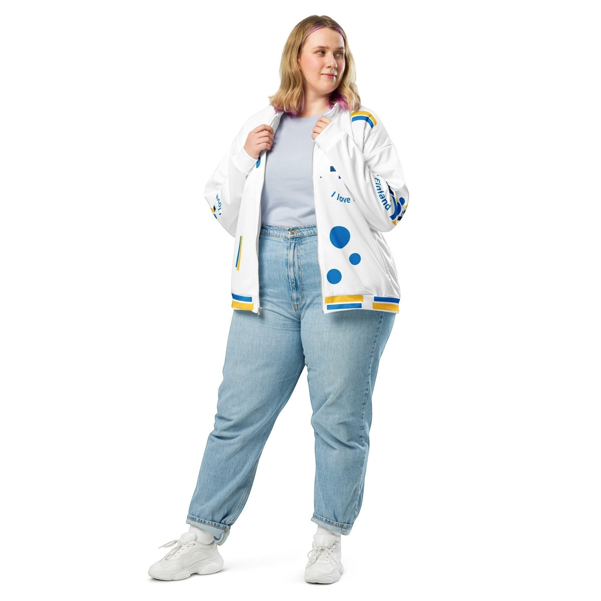 Good Wishes 365 white bomber jacket with blue and yellow Finnish flag motifs worn by a woman with light blue jeans.