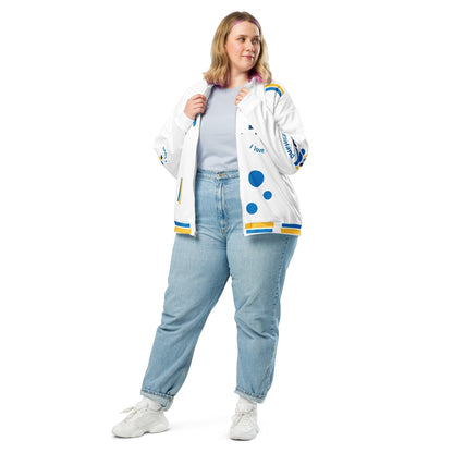 Good Wishes 365 white bomber jacket with blue and yellow Finnish flag motifs worn by a woman with light blue jeans.