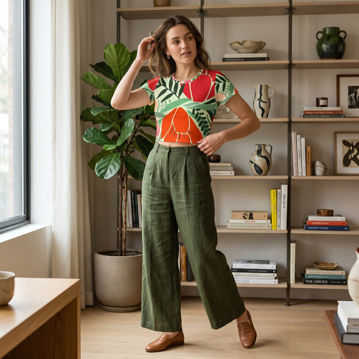 Good Wishes 365 mint crop tee with red and orange floral print, worn by a woman with olive green trousers.