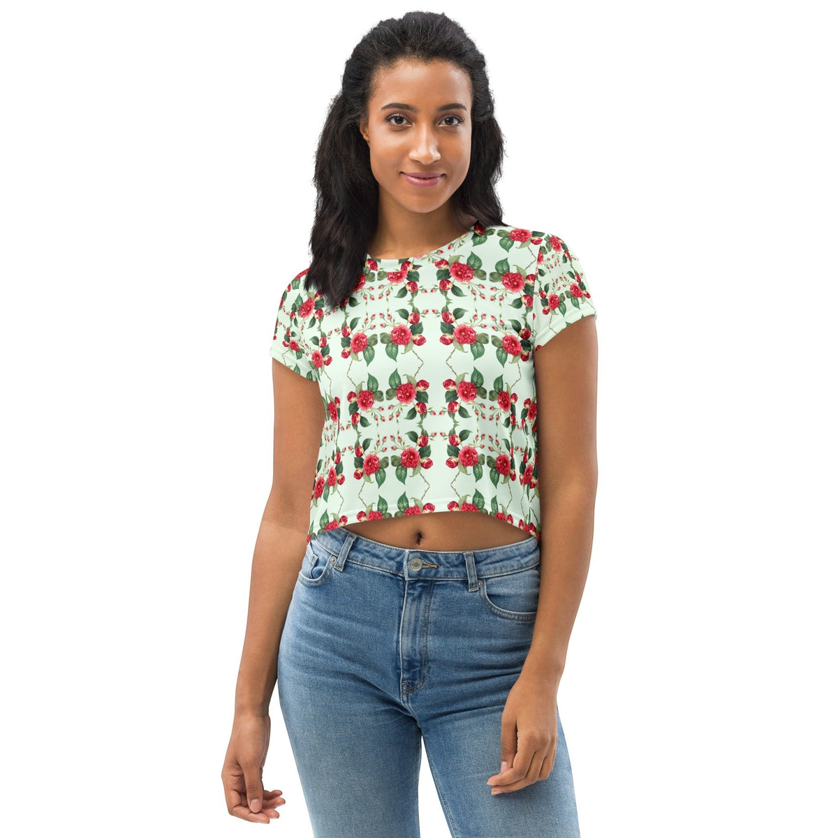 A model wearing a Good Wishes 365 mint green crop tee with an all-over red rose floral print and four-way stretch.