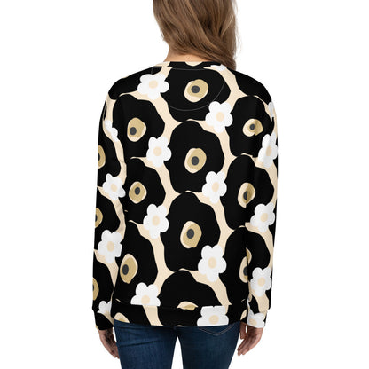 Good Wishes 365 recycled sweatshirt with black, white, and beige floral print, shown from the back on a woman.