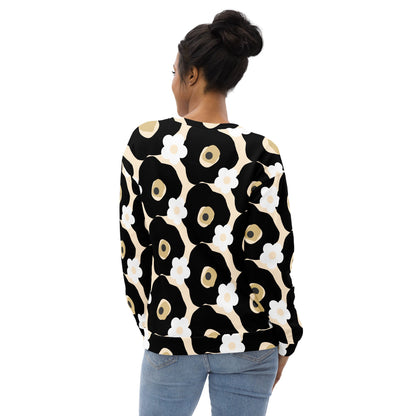Good Wishes 365 recycled sweatshirt with black, white, and beige floral print worn by a woman, back view