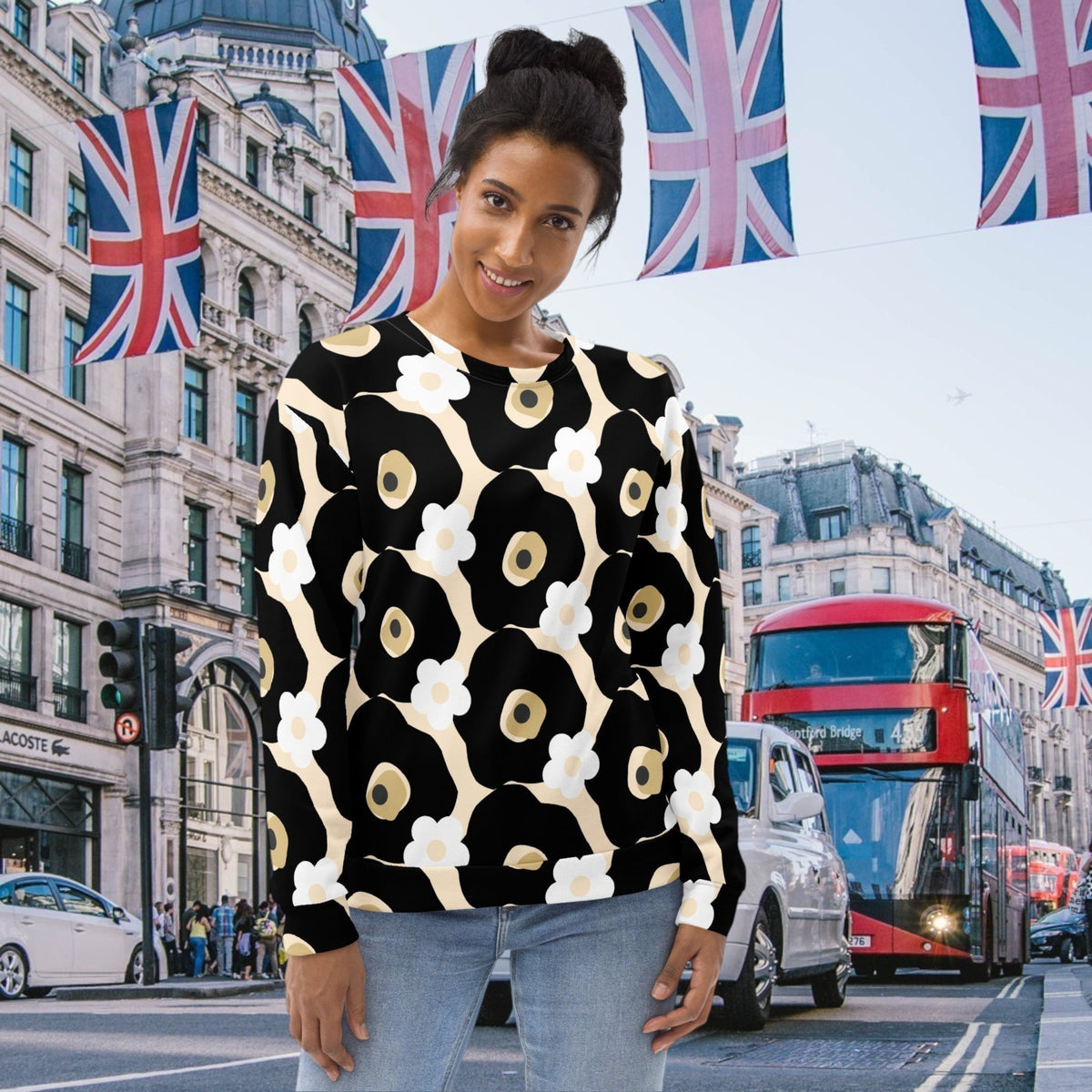 Good Wishes 365 recycled sweatshirt featuring a black, white, and beige floral print worn by a woman in London.
