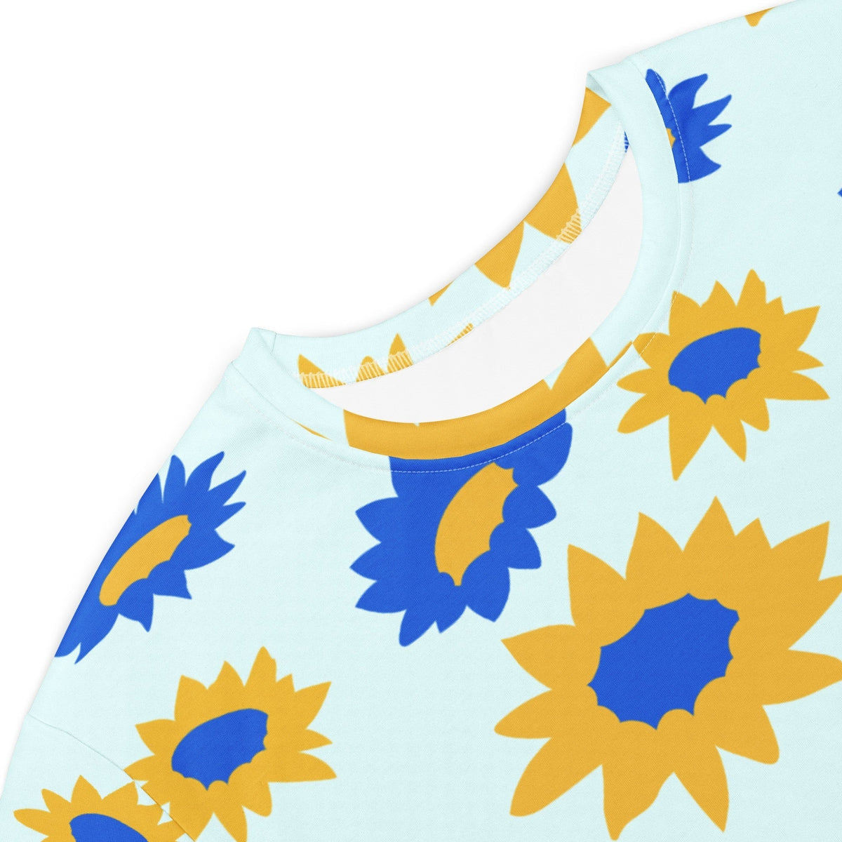 Good Wishes 365 light blue t-shirt dress featuring a vibrant all-over yellow and blue floral sunburst print.
