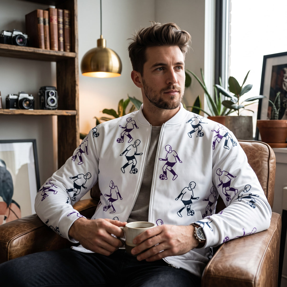 Good Wishes 365 white bomber jacket with purple football player print, featuring a silver zipper and fleece lining.