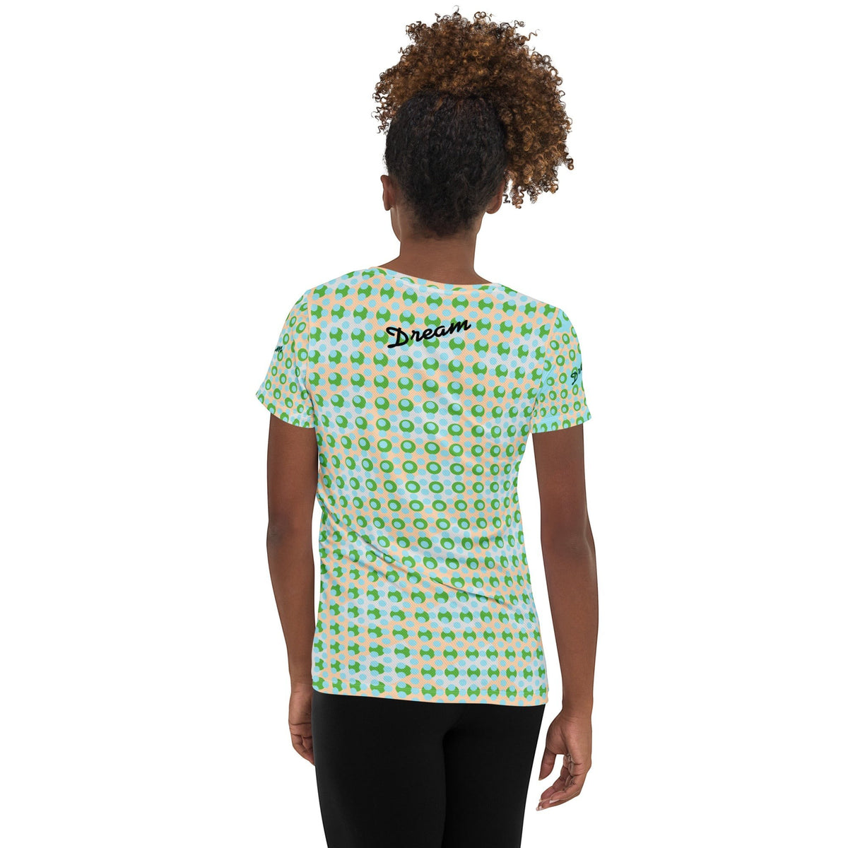 Good Wishes 365 women's athletic t-shirt with green and blue geometric pattern, worn by a model from the back view.