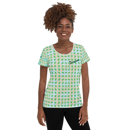 Good Wishes 365 women's athletic t-shirt with a green and blue geometric pattern and embroidered Dream chest logo