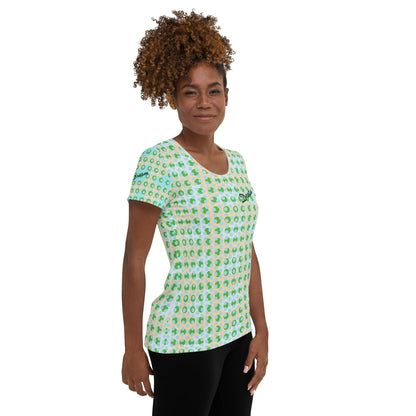 Good Wishes 365 athletic t-shirt with green and blue geometric pattern worn by a woman with curly hair