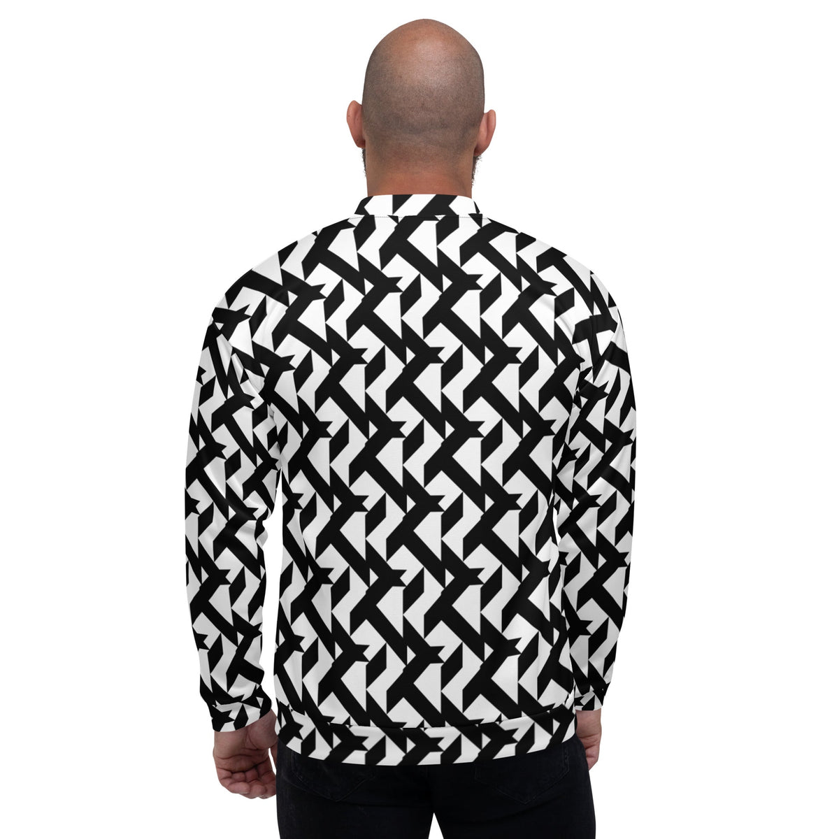 Back view of a Good Wishes 365 bomber jacket featuring a bold black and white geometric pattern on a bald male model.