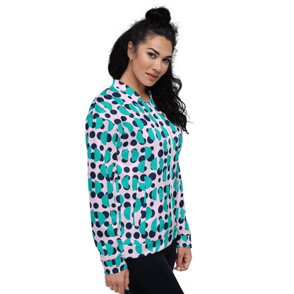 Good Wishes 365 unisex bomber jacket with navy polka dots and Irish blue semi-circles on a light pink background