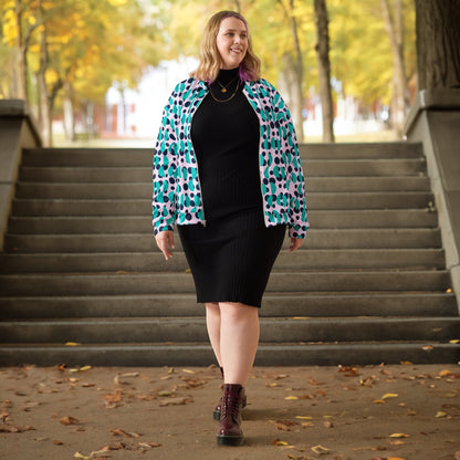 Good Wishes 365 bomber jacket with navy polka dots and blue semi-circles worn by a woman over a black ribbed dress