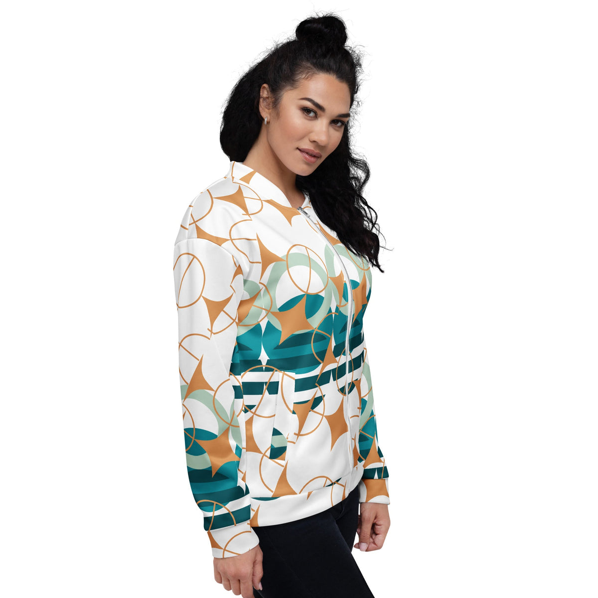 Good Wishes 365 bomber jacket in white with teal, sage, and ochre geometric star pattern worn by a woman