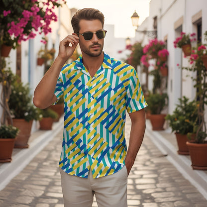 Good Wishes 365 unisex button shirt with a blue, yellow, and white geometric pattern in a sunny Mediterranean street.