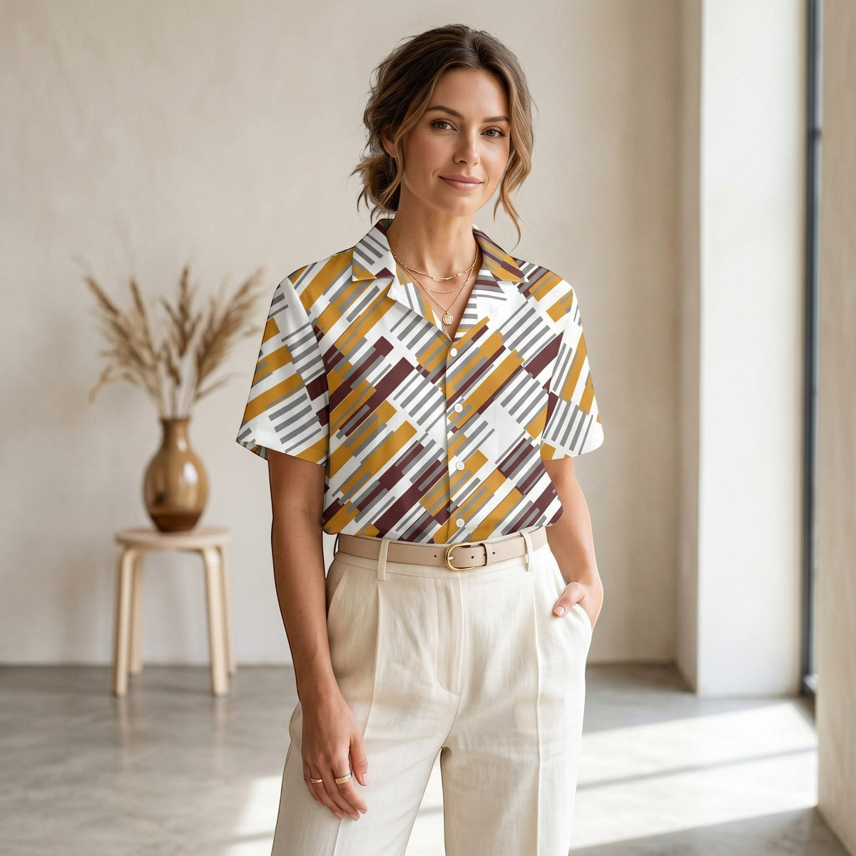 Good Wishes 365 unisex button shirt with a geometric pattern in yellow, brown, and grey, worn by a woman.