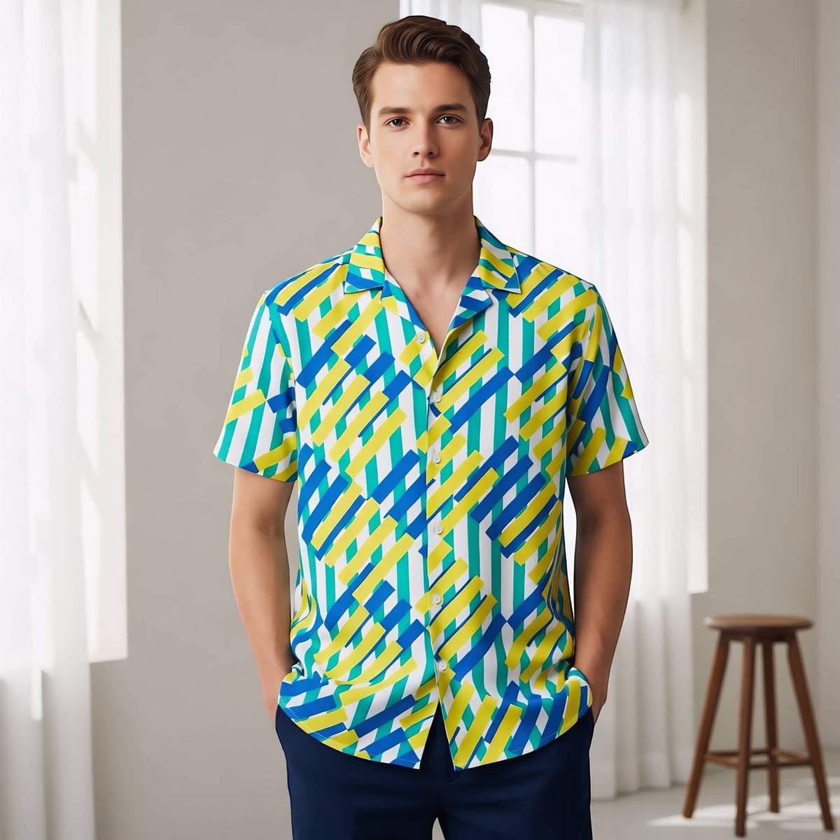 Good Wishes 365 unisex button shirt with a vibrant blue, yellow, and white geometric pattern in an oversized fit.