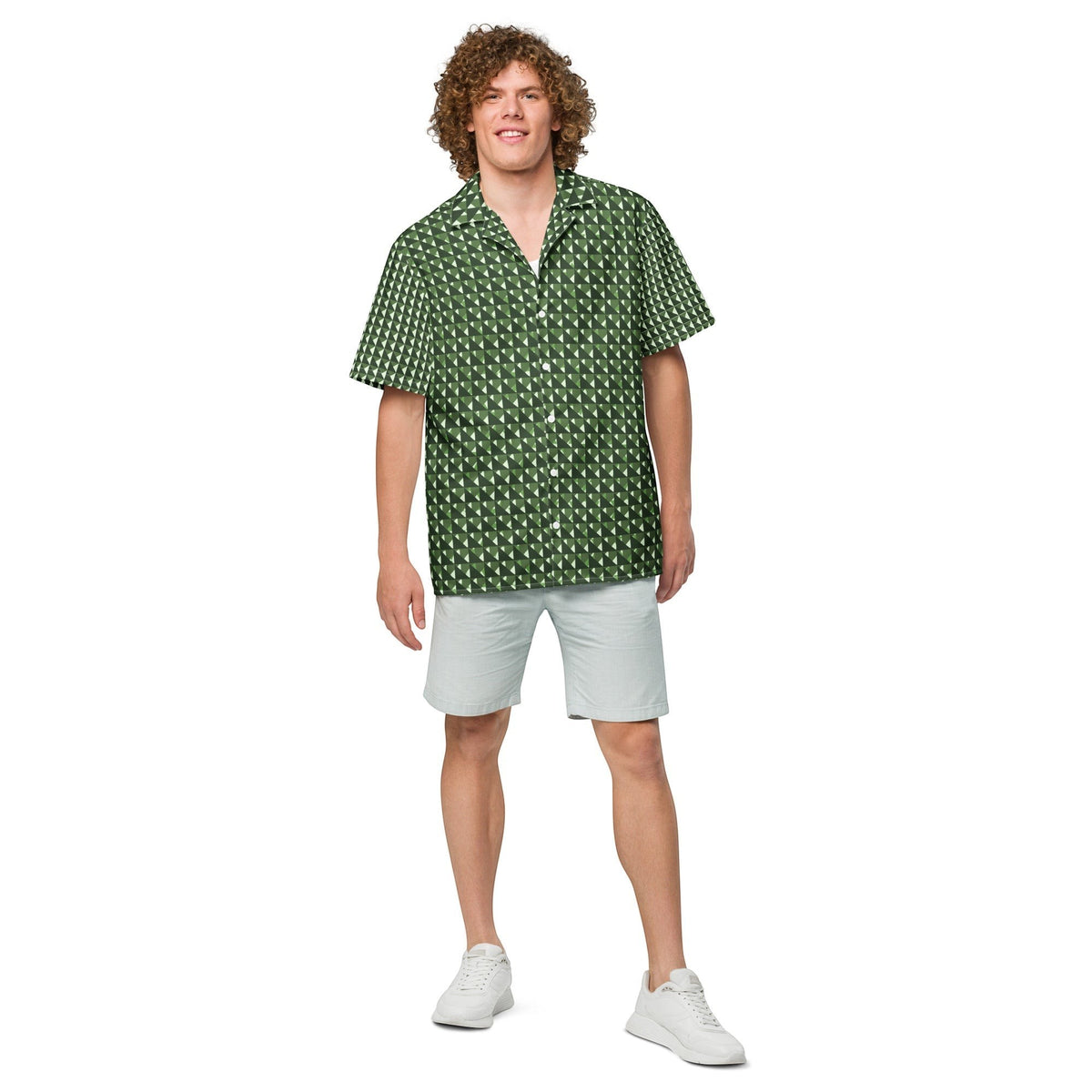 Good Wishes 365 men's short sleeve button shirt in green geometric triangle camo print, worn with light grey shorts.