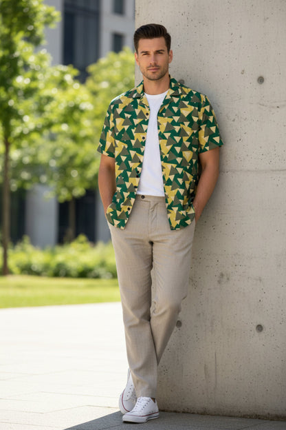 Good Wishes 365 Men's green, yellow, and tan geometric camo short sleeve button shirt with white t-shirt underneath.