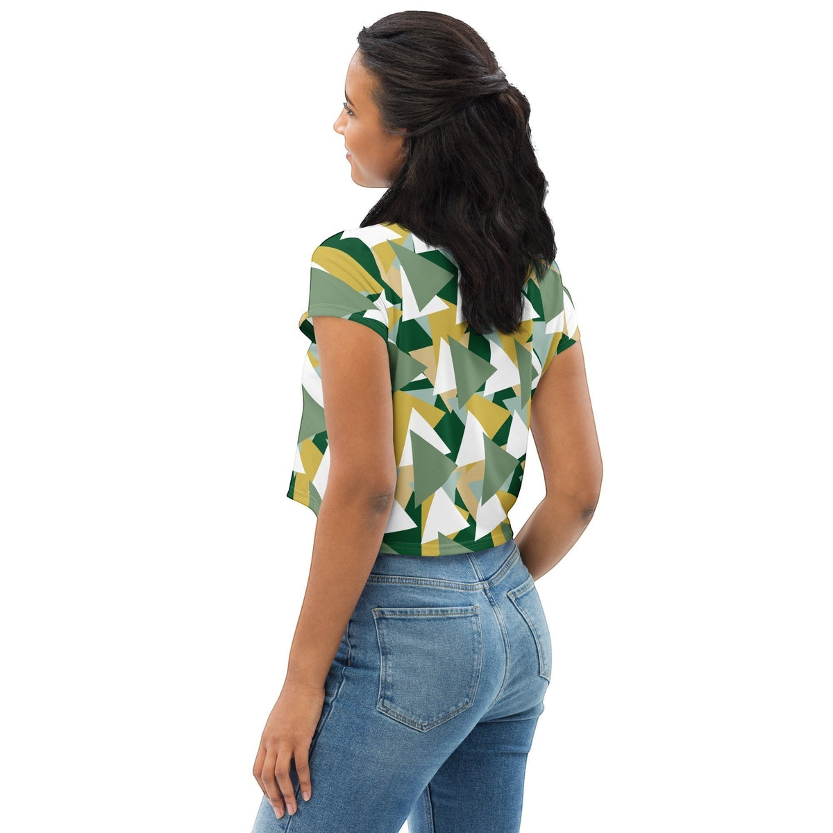 Good Wishes 365 crop tee with green and gold geometric camouflage print worn by a woman with blue jeans