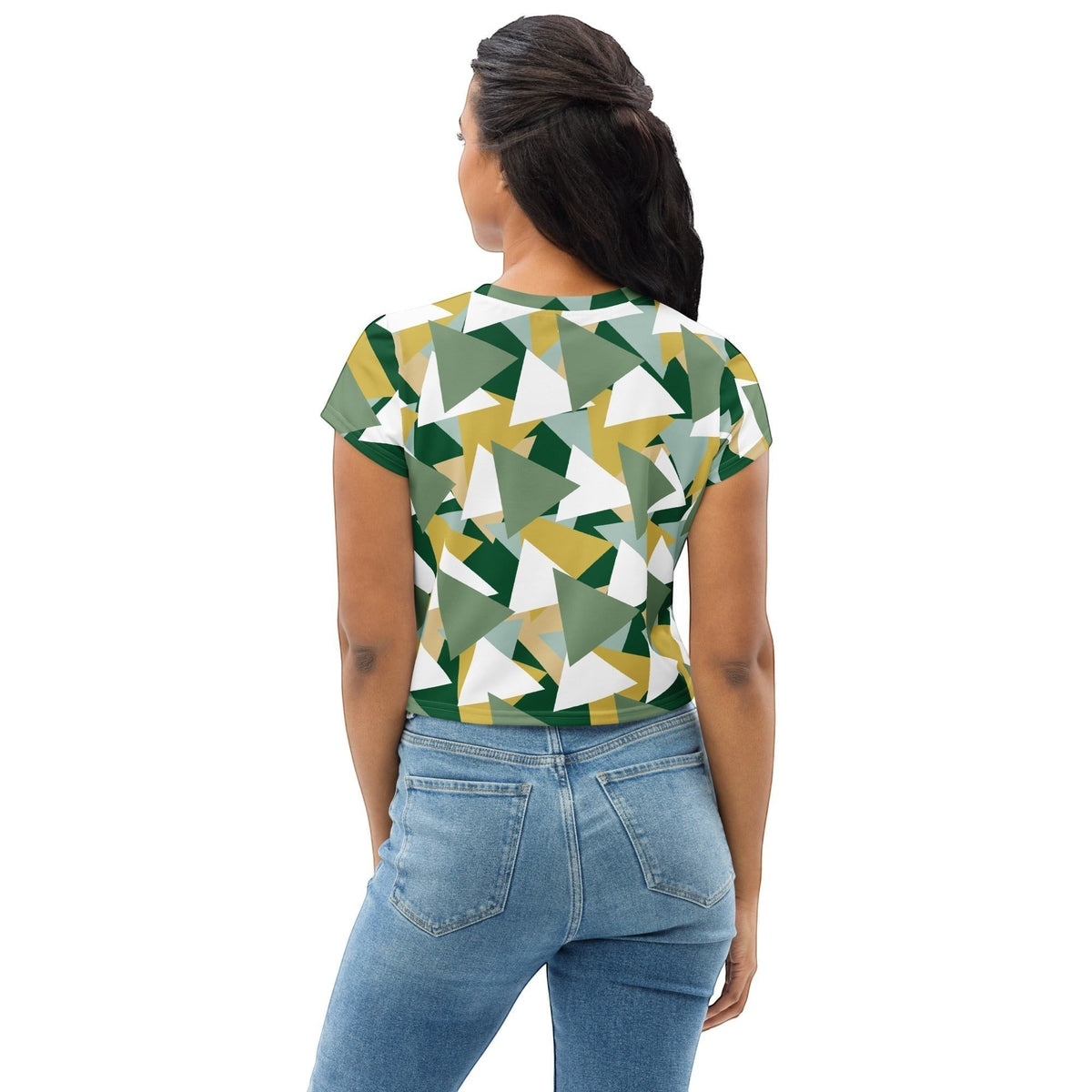 Good Wishes 365 crop tee featuring a geometric camouflage print in green, white, and gold, worn by a woman from behind.