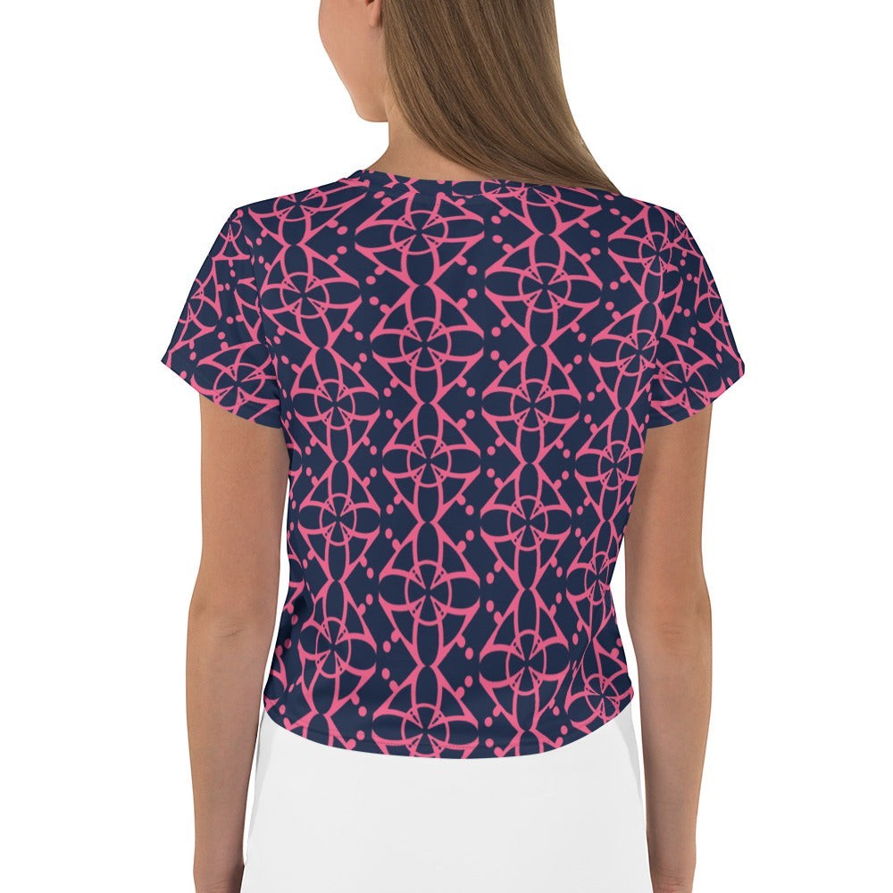 Good Wishes 365 navy blue crop tee with vibrant pink interconnected geometric pattern, back view on a model.