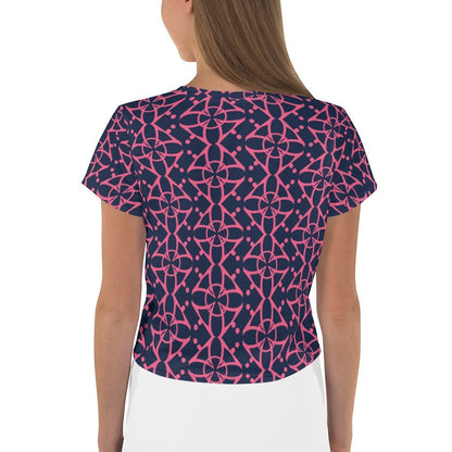 Good Wishes 365 navy blue crop tee with vibrant pink interconnected geometric pattern, back view on a model.